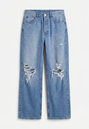 Μπλε τζιν παντελόνι με ψηλή μέση, φαρδιές ποδιές, εμπρόσθιες τσέπες και σκισμένα σημεία και στις δύο γόνατες.