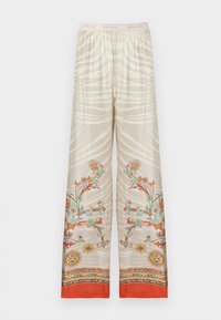 Pantalon beige à jambes larges avec des rayures zèbre blanches, des motifs floraux multicolores et des têtes de tigre près des ourlets, et une ceinture élastique avec le logo "just cavalli".
