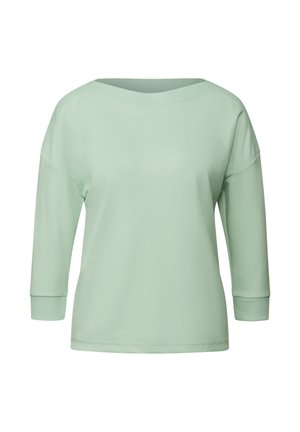 Haut vert clair à manches longues avec un large col côtelé et des poignets ajustés. Fabriqué en tissu lisse avec une coupe décontractée.