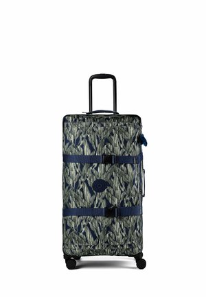 Tall wheeled suitcase with extended handle and patterned fabric in shades of green and navy, secured by two blue straps with buckles.