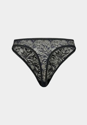 Zwarte kant thee met bloemenpatroon, contrasterende beige onderlaag, elastische tailleband en geribbelde randen. Fijne textuur overal.