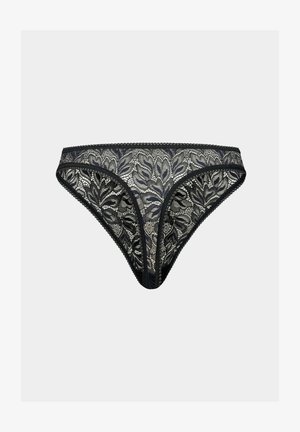 Zwarte kant thee met bloemenpatroon, contrasterende beige onderlaag, elastische tailleband en geribbelde randen. Fijne textuur overal.