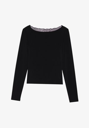 Black long-sleeve top with a scoop neckline and a cropped hem. Made from a smooth fabric with a subtle texture and a scalloped edge at the collar.