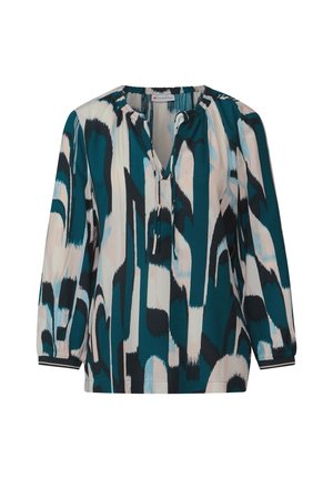 Blusa a motivi turchese e crema con scollatura a V e dettaglio con fiocco. Presenta maniche lunghe con polsini elasticizzati e una vestibilità ampia.
