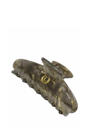 Transparenter grauer, marmorierter Kunststoff-Haarclip mit einem goldfarbenen, runden Logo auf einer Seite und gezackten Greifzähnen an der Unterseite.