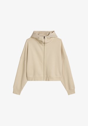 Beige cropped hoodie met rits, lange mouwen, een ritssluiting aan de voorkant en een losse pasvorm.