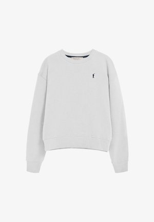 Sweat-shirt gris clair avec un col rond, des manches longues, des poignets et un ourlet côtelés. Présente un petit logo marine sur la poitrine. Texture du tissu douce.