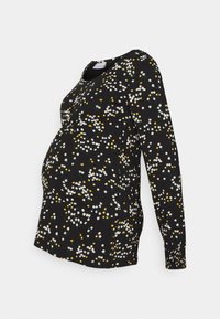 Černý těhotenský top s dlouhým rukávem a květinovým vzorem v bílé, žluté a zelené barvě. Měkká tkanina s zakřiveným lemem a kulatým výstřihem.