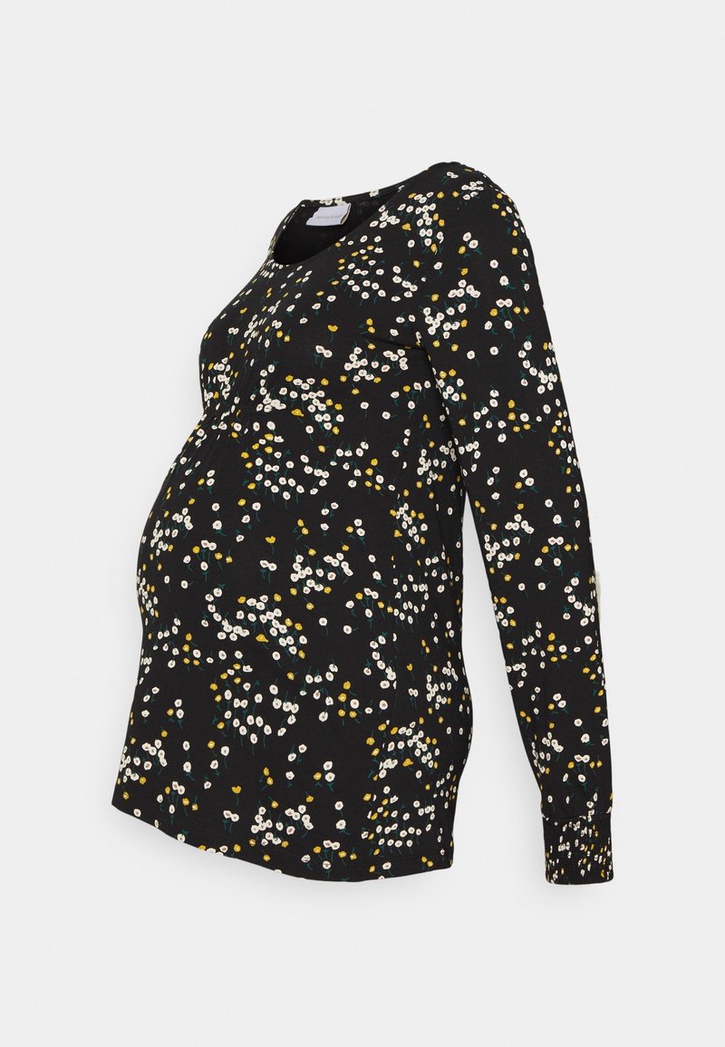 Černý těhotenský top s dlouhým rukávem a květinovým vzorem v bílé, žluté a zelené barvě. Měkká tkanina s zakřiveným lemem a kulatým výstřihem.