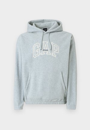 Sweatshirt cinzento em mistura de algodão com bolso frontal, cordões e logótipo "GAP Athletic" em creme. Textura macia, corte confortável, punhos e bainha canelados.