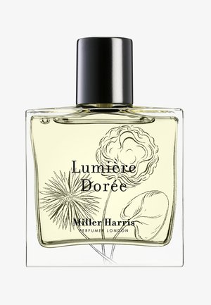 Rechteckige Parfümflasche mit schwarzem Verschluss, hellgelber Flüssigkeit, floralen Illustrationen und dem Text "Lumiere Dorée Miller Harris Perfumer London."