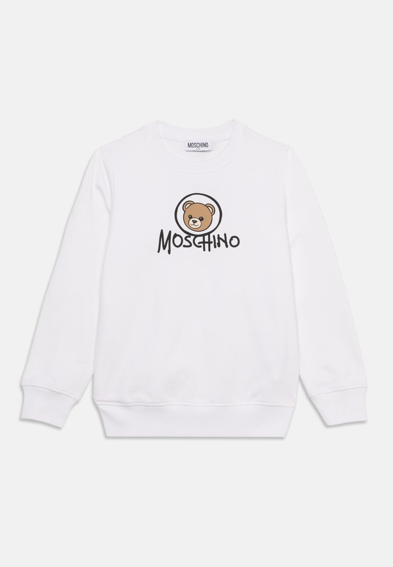 Sweat-shirt blanc à manches longues avec un col rond, featuring un visage d'ours en peluche marron et le mot "Moschino" en noir sur le devant.