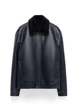 Black leather jacket with black fur collar, front snap buttons, long sleeves, and two vertical side pockets, displayed on white background.