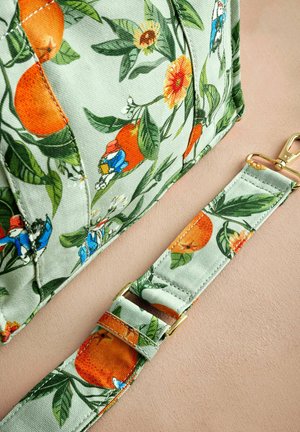 Green fabric bag with orange and floral patterns, featuring a gold hardware strap and detailed stitching. Smooth texture.