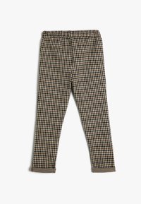 Bruine en zwarte gepatteerde broek met een elastische tailleband en manchetten. Het ontwerp heeft een klassieke houndstooth-patroon en een zachte textuur.