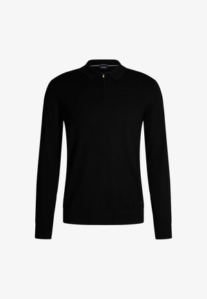 Zwarte gebreide trui met een ritskraag, lange mouwen, en geribbelde manchetten en onderrand. Bevat een klein logo aan de onderzijde.