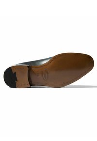 Semelle en cuir de chaussure habillée avec une finition marron, présentant une texture lisse, des coutures discrètes et un accent en caoutchouc noir au talon. Taille 42.