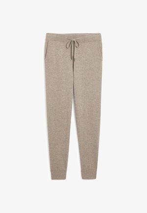 Beige Strick-Jogginghosen mit eng zulaufenden Beinen, elastischem Bund, Kordelzug und Seitentaschen. Weiche Textur mit glatter Oberfläche.