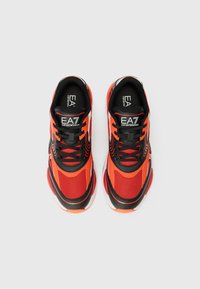 Red and black athletic shoes with mesh upper, contrasting orange accents, padded collar, and rubber sole. Features EA7 logo on the tongue.