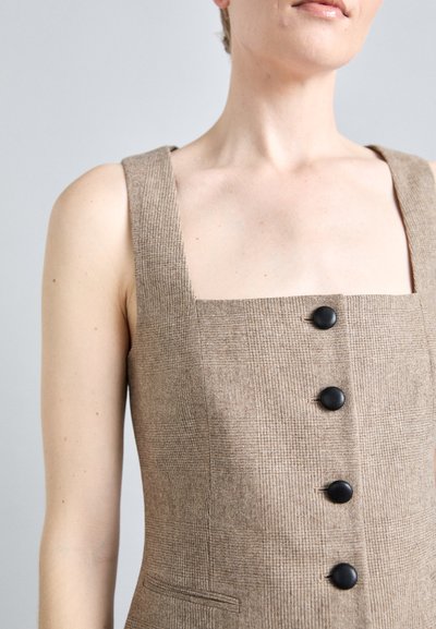 Brown, textured vest with a square neckline, featuring black buttons and side pockets. Smooth fabric with a check pattern.