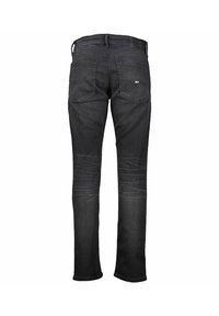 Jeans de mezclilla oscura con corte recto, que cuentan con un diseño clásico de cinco bolsillos, un desgaste sutil en los muslos y una cinturilla estándar con trabillas para el cinturón.