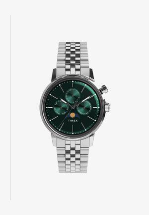 Orologio in acciaio inox silver con quadrante verde, tre sottodial e indicatore della data. Presenta un bracciale con maglie testurizzate. Marca: Timex.