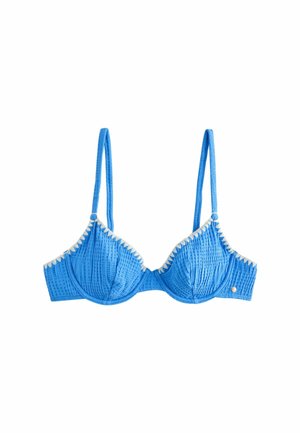 Modrá štruktúrovaná podprsenka s kostícami, tenkými nastaviteľnými ramienkami a bielym vlnkovaným lemom pozdĺž horných okrajov.