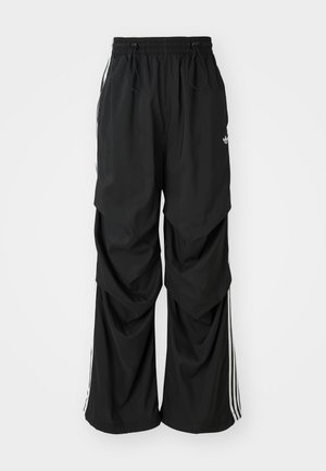 Black loose-fitting pants with an elastic waistband, drawstring, and white side stripes; made of lightweight fabric with a smooth texture.