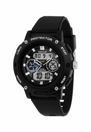 Digital sports watch with a black rubber strap, round case, white and black dial, silver accents, features include backlight and stopwatch.