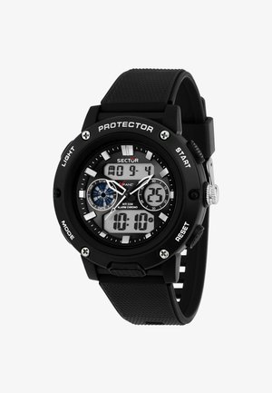 Digital sportsur med sort gummirem, rund sag, hvid og sort skive, sølvdetaljer, funktioner inkluderer baggrundsbelysning og stopwatch.