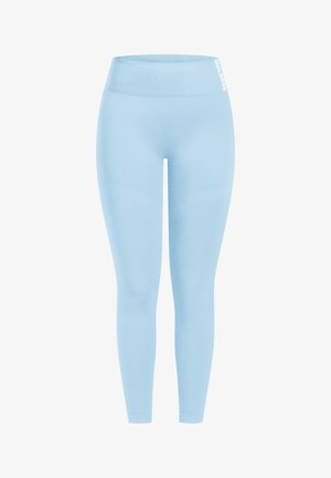 Lichtblauwe leggings met een naadloos ontwerp, hoge tailleband en subtiele glans. Heeft een wit logo aan de bovenkant.