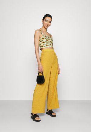 Topper - black dark/sunflower/white