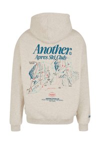 Sudadera beige con estampado en la parte trasera que presenta un mapa de una estación de esquí en azul y rojo, etiquetado con detalles de las pistas. Hecha de una mezcla de algodón, con puños acanalados.