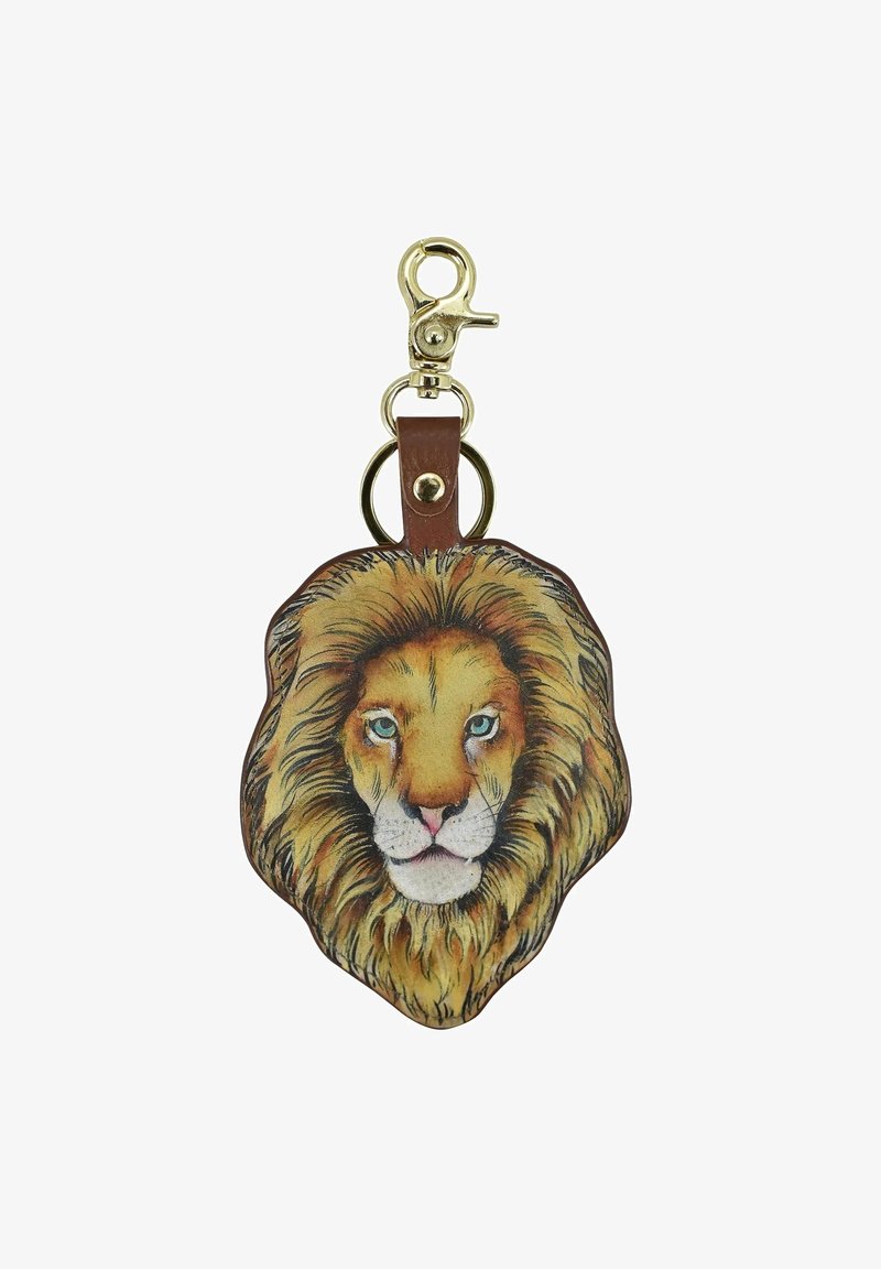 Löwenförmiger Schlüsselanhänger mit detaillierter Illustration, der eine goldene Mähne und blaue Augen zeigt, befestigt an einem braunen Lederband mit einem goldenen Clip.