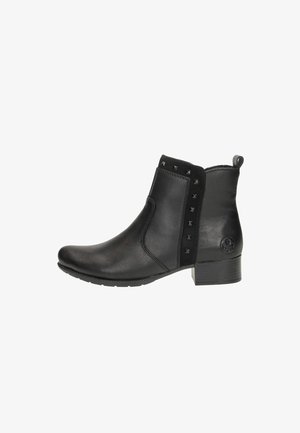 Bottines noires en cuir, avec un bout arrondi, des clous décoratifs sur le côté et un petit talon carré.