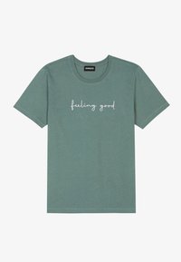 Green cotton t-shirt with a crew neck and short sleeves, featuring the text "feeling good" in white cursive font across the chest.