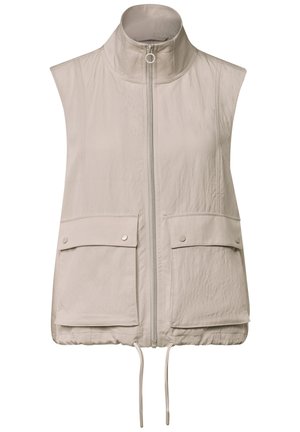 Veste beige sans manches avec col montant, fermeture éclair sur le devant, deux poches à rabat avec bouton-pression et cordons ajustables à l’ourlet.
