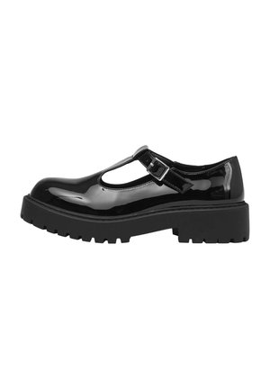 Scarpe Mary Jane nere in vernice con T-strap, dettaglio con fibbia e suola in gomma nera spessa e scanalata.