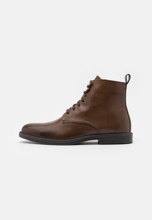 Botines con cordones - cognac