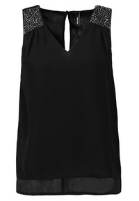 Svart ärmlös blus med V-hals, med axlar prydda av paljetter och ett nyckelhål i ryggen. Tillverkad av lätt och mjukt material.