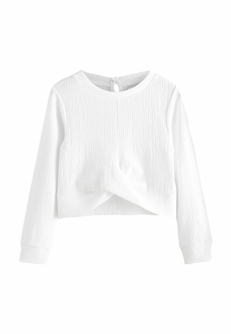 Biely dlhý rukáv crop top v textúrovanej látke s okrúhlym výstrihom a uzlom vpredu. Obsahuje zapínanie na gombík na zadnej strane.