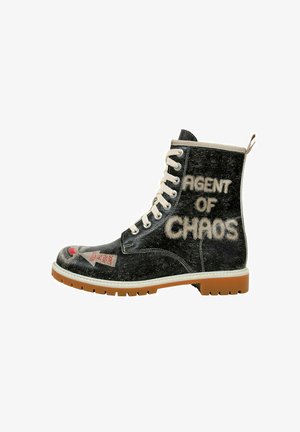 Black leather boot with a textured finish, featuring "AGENT OF CHAOS" in beige lettering, cream laces, and a rubber sole with traction.