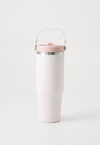 Insulated travel mug with a white body, pink lid, and stainless steel rim. Features a removable handle for easy carrying.
