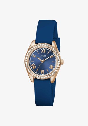 Ur med navyblå silikonerem, rosaguld urkrans, krystal-detaljer og en mørkeblå urskive med romertal.