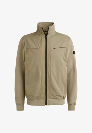 Giacca beige con zip e alto colletto, due tasche sul petto con zip, polsini a costine e una texture liscia in tutto. Presenta zip scure a contrasto.