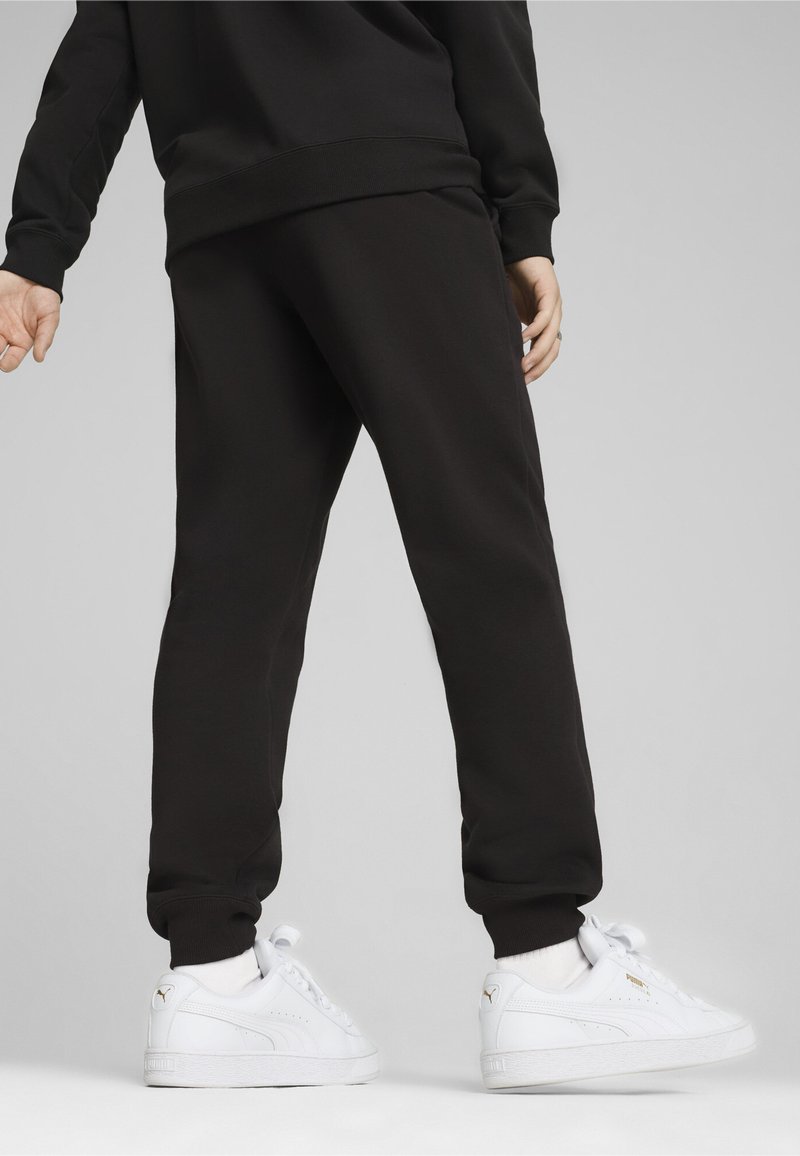 Puma SQUAD JOGGING - Teplákové kalhoty - black