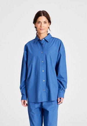 Blue button-up shirt with a pocket, long sleeves, and a collared neck. Made from a smooth, lightweight fabric with a relaxed fit.