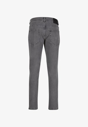 Gray denim jeans with a slim fit, featuring two back pockets and a black waistband patch. The fabric has a subtle texture and finish.