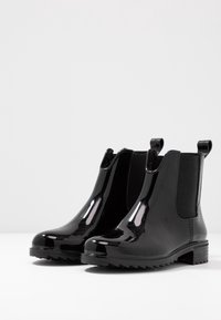 Rieker Bottes en caoutchouc - black