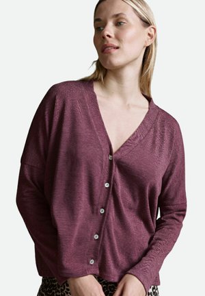 Plum knit cardigan with a V-neck, long sleeves, and contrasting button closures. Textured fabric with a relaxed fit.